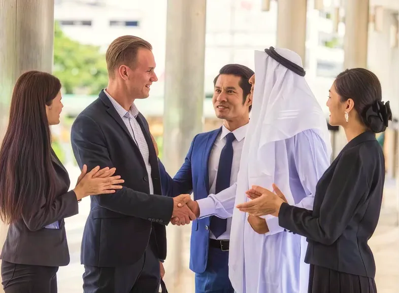 Colleagues shaking hands at the start of a meeting